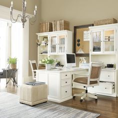 a home office with desk, chair and bookshelf