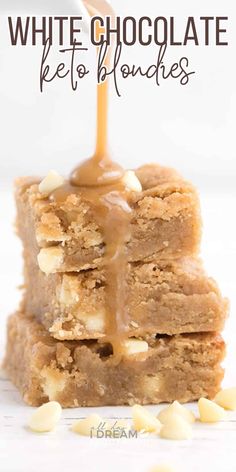 white chocolate keto blondies stacked on top of each other with peanut butter drizzle