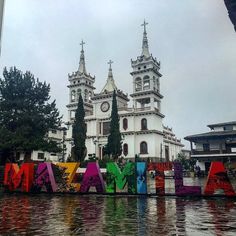 there is a large building with many letters in front of it that spell out the word italy