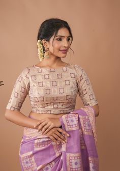 Step into elegance with the Lilac Patola design Banarasi Brocade Boat Neck Blouse. This exquisite blouse, crafted from luxurious Banarasi Brocade fabric, offers a rich texture and a soft, lustrous finish that enhances its sophisticated appeal. The delicate lilac hue, complemented by subtle checked patterns, adds a refreshing touch of color and a hint of classic charm. The boat neck design in teh front and step neck in the back provides a graceful and flattering neckline, enhancing the blouse's refined silhouette while adding a modern twist to traditional styling. Perfectly suited for pairing with both contemporary and traditional sarees, this blouse combines the opulence of raw silk with the timeless elegance of checked patterns. Ideal for festive occasions, formal events, or special gathe Boat Neckline Blouse, Boat Neck Blouse Back Design, Kurti Style Blouse, Formal Blouse Designs For Saree, Boot Neck Blouse Design, Benaras Blouse Designs Latest, Blouse Design Front Neck, Boat Neck Blouse Designs Front And Back, Boat Neck Designs For Blouse