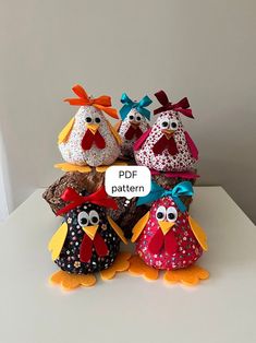 three stuffed birds are sitting on top of each other