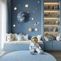 a child's room decorated in blue and white with an astronaut themed wall mural