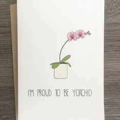 a card that says i'm proud to be yorchid with a pink flower in a white vase