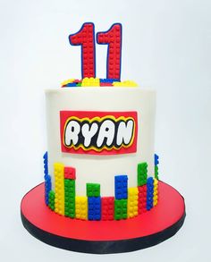 a birthday cake made to look like legos with the number one on it and name ryan