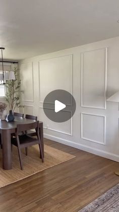 a living room with wood floors and white walls