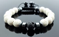 ☮ Men's handmade adjustable bracelet features 10mm white and black lava beads, and hematite heishi beads. Bracelet is constructed with nylon and waxed cotton cording for durable and comfortable wear. ☮ Lava beads give you the option of turning this bracelet into an aroma therapy diffuser bracelet. Place your favorite essential oil directly onto the lava beads and the porous stone will absorb and diffuse the essential oils scent. ☮ Bracelet measures 7 1/2 inches around when it is fully closed but Adjustable Lava Stone Beaded Bracelets, Casual Hand-strung Beaded Bracelets With Lava Stone, Casual Adjustable Lava Stone Beaded Bracelets, Casual Hand-strung Lava Stone Beaded Bracelets, Adjustable Lava Stone Beaded Bracelets With Natural Stones, Casual Beaded Lava Stone Bracelets, Handmade Adjustable Lava Stone Beaded Bracelets, Adjustable 8mm Lava Stone Beaded Bracelets, Adjustable Lava Stone Bracelets With Gemstone Beads