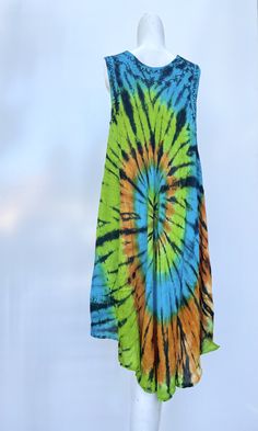 This summer, treat yourself to one (or more!) of our dresses. Loose, comfortable, and perfect for everyday! HELPFUL DETAILS: ‣ Comfortable, smooth, and flowy ‣ Perfect for shopping, picnics, parties, bonfires, walks, lounging, gifts, etc. ‣ SUPER flowy which is perfect as a swimsuit/beach coverup ‣ Bright and vivid colors + CUTE TIE DYE SPIRAL DESIGN! ‣ Comfortable, Smooth, Flowy Rayon ‣ ONE SIZE FITS MOST! (very VERY flowy and spacious) ‣ Length: 44 inches ‣ Bust (Chest): 44 inches ‣ Perfect as Green Bohemian Sleeveless Beach Dress, Green Flowy Sleeveless Summer Dress, Sleeveless Tie Dye Bohemian Dress, Flowy Multicolor Sleeveless Summer Dress, Bohemian Sleeveless Tie Dye Dress, Green Summer Festival Dress, Multicolor Sleeveless Beach Dress For Festival, Green Hippie Sundress For Beach, Sleeveless Tie-dye Dresses For Beach Season