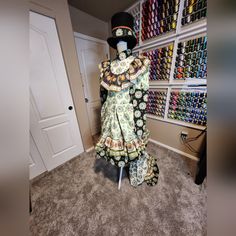 the mannequin is dressed in an elaborate dress