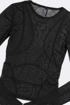 This item is subject to a 15% restocking fee if returned. A sheeru00a0mesh fitted long sleeve top withu00a0contour panels. Whatever your mood, spicy or sporty, wear this top at the gym or a night out on the town. Sheer perfection. u00a0 Content + Care \-u00a0Recycled Polyester Wash in cold water, hang dry Hand Made in Los Angelesu00a0 Size \-u00a0XS - 2XL One-of-a-Kind Vintage Authentic vintage piece, handpicked from around the world. One-of-a-Kind Vintage styles are singularly circular, extendi Black Second-skin Top For Party, Black Nylon Mesh Top With Long Sleeves, Black Nylon Long Sleeve Mesh Top, Nylon Mesh Top With Long Mesh Sleeves, Long Sleeve Nylon Mesh Top With Mesh Sleeves, Sheer Nylon Tops For Fall, Long Sleeve Mesh Top With Mesh Sleeves, Fitted Mesh Top For Night Out, Fitted Mesh Top For A Night Out