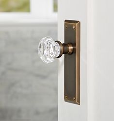 an open door with a glass knob on it