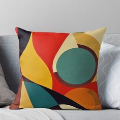 a throw pillow with an abstract design on it