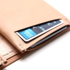 The classic slim wallet with a modern twist. It is designed with a large compartment for unfolded bills and two neat compartments for cards, with two slots for quick access to frequently used cards. The minimalist wallet is crafted from Italian vegetable tanned leather and stitched by Leather Wallet Design, Italian Vegetables, Leather Mouse, Leather Mouse Pad, Minimalist Leather Wallet, Leather Workshop, Leather Coin Purse, Leather Bifold Wallet, Leather Wallets