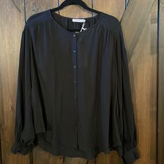 This Is A Beautiful Blouse By Lush In A Size Large, With Button Cuffs, And Button Front, It Is Higher In The Front And Longer In The Back, And Is Absolutely Beautiful. Send Me Any Questions You Have And Thank You For Looking! Black Tops With Covered Buttons For Fall, Black Blouse With Button Cuffs For Daywear, Black Button-up Tops With Covered Buttons, Black Blouse With Button Closure For Daywear, Black Button-up Blouse With Back Button Closure, Black Button-up Blouse With Button Closure, Chic Black Blouse With Button Cuffs, Black Button-up Blouse For Daywear, Tan Blouse