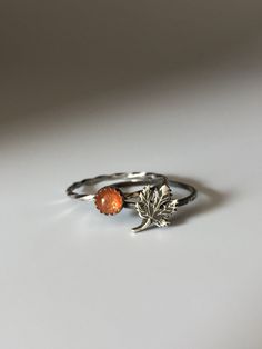 Welcome to Miss November Studio! I specialize in dainty feminine personalized jewelry for the discerning jewelry lover. This listing is for a single sterling silver maple leaf stacking ring. All other rings are sold separately. Make a stack! Add a custom stamped band and two gemstone stacking rings with stones like black onyx and garnet. https://www.etsy.com/listing/150142799/set-of-3-rings-one-personalized-message ********** Stacking rings are excellent accessories, not to mention fun to collec Minimalist Sterling Silver Leaf Jewelry, Minimalist Leaf-shaped Sterling Silver Jewelry, Hypoallergenic Leaf-shaped Nature-inspired Jewelry, Everyday Nature-inspired Leaf Jewelry, Everyday Sterling Silver Leaf Jewelry, Nature-inspired Stackable Rings For Gifts, Nature-inspired Leaf Jewelry For Everyday, Adjustable Silver Leaf Jewelry, Dainty Amber Sterling Silver Jewelry