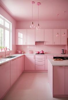 a kitchen with pink cabinets and white counter tops