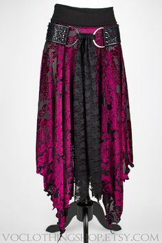 Super soft and semi-sheer BLACK VELVET BURNOUT maxi skirt with lots of fullness and a witchy, pointed petal edge hem. Wide cotton spandex fold-over waistband sits just below your natural waistline, or you can pull it down over your hips for extra length. 100% Handmade in Los Angeles, CA USA. SIZES (designed to fit the following body measurements): XS :: fits 24"-25" waist S :: fits 26"-28" waist M :: fits 29"-31" waist L :: fits 32"-35" waist XL :: fits 36"-39" waist XXL :: fits 40"-44" waist Wa Long Flowing Skirt Outfits, Black Gothic Velvet Bottoms, Black Velvet Gothic Bottoms, Black Lace Skirt For Costume Party, Bohemian Fitted Skirt For Halloween, Gothic Boho Fashion, Witchy Summer Outfits, Goth Hippie Outfits, Witch Skirt