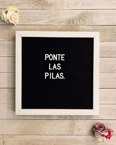 a black and white frame with the words ponte las pilas written on it