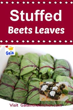 stuffed beets leaves in a white dish with garnishes on the side