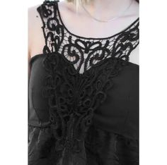 This stylish tank top features intricate eyelet lace detailing, a padded bra, and a v-style neckline with an elastic back. Fresh from the manufacturer, these items are being sold for the first time without tags. Crafted from polyester, it's a perfect choice for any occasion. Sleeveless Lace Top With Lace Closure, Fitted Sleeveless Tank Top With Lace Bodice, Fitted Sleeveless Lace Top With Lace Closure, Fitted Lace Bodice Sleeveless Tank Top, Black Sleeveless Lace Top With Contrast Lace, Evening Cami Tank Top With Lace Trim, Lace Top With Built-in Bra For Night Out, Lace Trim Tank Top For Night Out, Party Lace Tank Top With Patchwork