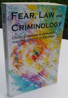 a book about fear, law and criminology sitting on a white table