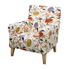 an upholstered chair with colorful flowers and leaves on the back, against a white background