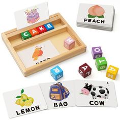 a wooden tray filled with matching cards and dices