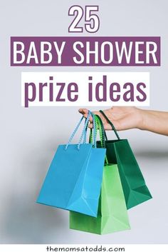 a hand holding shopping bags with the words 25 baby shower prize ideas on it in purple and green