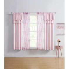 the pink curtains are hanging on the window sill in front of the white wall