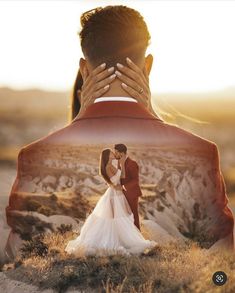 a bride and groom kissing in the desert