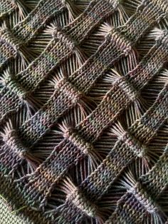 a close up view of a knitted piece of cloth that has been stitched together