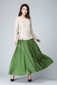 "This chic light green maxi skirt created with a soft linen, design with a fit and flare silhouette for a feminine feel , completed with a fitted waist for a defined figure. DETAIL * Soft linen * 50% linen , 50 cotton * No lining * Seam pocket * Right side zipper closure * Ankle Length * A Line skirt, button front skirt * Wash by hand or machine with cold water * Perfect spring, summer, autumn SIZE GUIDE Size vary between Brand and Country Please get your body measurement with our Size Guide And Green Buttoned Skirt For Summer, Spring Maxi Skirt With Buttons, Spring Flowy Buttoned Maxi Skirt, Spring Buttoned Flowy Maxi Skirt, Spring Flowy Maxi Skirt With Buttons, Summer Flared Maxi Skirt With Buttons, Spring Buttoned Flared Maxi Skirt, Spring Linen Skirt With Buttons, Spring Midi Maxi Skirt With Buttons