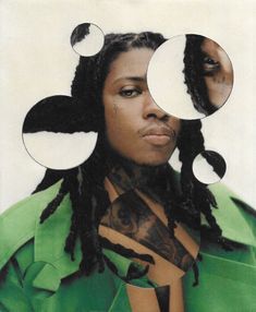 a woman with dreadlocks is looking at her reflection in the mirror that she has two circles over her face