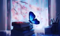 a butterfly that is flying over some books