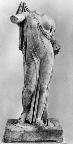 an ancient statue is shown in black and white