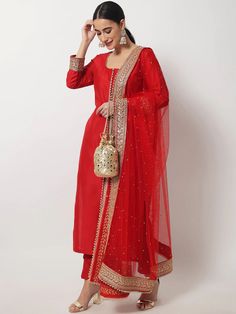 This is a beautiful 3 piece suit set. It comes with thread embellished straight cut kurta has 3/4th sleeves, round neck, calf length teamed with solid trouser pants and a net dupatta with zari & stones detailing. 3 piece set Color- Red Work- Beads & Zari Embellished Detailing Kurti Length - 46 inch Kurta Fabric-Silk Bottom Fabric - Silk Dupatta Fabric-Net with Zari & Stones Detailing Sleeves-3/4th Sleeves Neck-Round Neck Care - Dry Clean Note - The set does not include potli bag Red Kurti Outfit, Embellished Suit, Red Anarkali Suits, Suits For Women Indian, Red Kurti, Bridal Suits, Red Kurta, Bridal Dupatta, Diwali Outfits