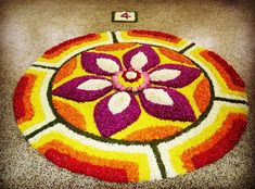 a colorful flower design on the ground