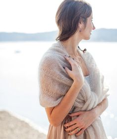 The Design “Ruffles with restraint.” Our ruched scarf, designed by Jennifer Evans, was created to add subtle feminine flourish to the scarf equation (think of it as ruffles with restraint). We couldn't resist turning the gathered bands on their side with a lacier yarn for an ethereal wrap on a dramatic scale. Wear it as a party shawl, or as an unexpected scarf over a tailored coat. Heaven! See how we've used this pattern! The Details FINISHED SIZESScarf: Approx. 6 x 72"/15 x 183cm.Wrap: Approx. Knitting Patterns Wrap Shawl, Waterfall Scarf Pattern, Wrap Scarf Sewing Pattern, Comfort Shawl, Knit Wrap Pattern, Rowan Felted Tweed, Cape Pattern, Scarf Yarn, Tailored Coat