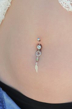 "A one of a kind belly button ring full of boho-chic style! Handmade of a Sterling Silver barbell, dreamcatcher and feather pendants, and Swarovski beads. Quality meets style for the hottest look out there! Do not hesitate to contact me for special requests and customization! ♥♥ ▶ 14K goldfilled curved barbell, 11 mm long (not including the barbells) for a universal fit. ▶ Swarovski faceted crystal beads- Light pink, green and light red color ▶Silver dreamcatcher and feather pendants, 4 cm (1.57 Nickel Free Bohemian Body Jewelry For Festivals, Bohemian Internally Threaded Body Jewelry As Gift, Bohemian Belly Rings As A Gift, Bohemian Handmade Belly Rings For Gifts, Bohemian Handmade Belly Rings As Gifts, Light Red Color, Bellybutton Piercings, Belly Button Piercing Jewelry, Belly Piercing Jewelry