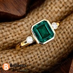 "MADE TO ORDER * Material: Solid gold(10K/14K/18K white/yellow/rose gold), Platinum, 925 Sterling Silver * DETAILS - Center Stone: Lab Created Emerald - Cut:Emearld Cut 7*8mm - Total weight: 2.5 ctw - Side stone: Moissanite - Total weight: 0.10 ctw (High Quality) - Cut: Round - Color: DF -  Clarity: VVS - Band Width: 2.0mm * Click on the \"Pin It\" icon if you like this item ✥ O T H E R ∙ I N F O R M A T I ON ✥ ♦ Your item will be nicely packed to gift in elegant jewelry boxes. ♦ Custom Order We can make custom rings in almost any shape and style. If you want a specific model, please send us a clear picture and we will do our best. ♦ Shipping Most items take 3-4 weeks to create.I'm happy to rush your order, fees may apply, write me for details. ♦ Payment Plans I offer payment plans. The mi Ring Three Stone, Zierlicher Ring, Lab Created Emerald, Emerald Engagement, Emerald Engagement Ring, Green Gemstones, Dainty Ring, Jewelry Boxes, Anniversary Ring