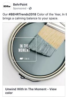 a paint can with a brush on top of it and the words in the moment below