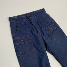 "Levis bush pants Childrens size 23\" waist cut off legs measure 9\" inseam Very cool only because theyre bush pants." Retro High Waist Cargo Jeans With Pockets, Retro High Waist Cargo Jeans, Retro High-waist Cargo Jeans With Pockets, Vintage Straight Leg Cargo Jeans With Side Pockets, Retro Workwear Bottoms With Patch Pockets, Retro Straight Leg Bottoms With Cargo Pockets, Retro Straight Leg Pants With Pockets, Retro Straight Leg Bottoms With Side Pockets, Retro High Waist Bottoms With Five Pockets