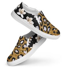 The women's canvas slip on sneakers are a stylish and comfortable option for everyday wear. The sneakers feature a leopard glitter print that adds a pop of glamour and fun to any outfit. The back of the shoe is adorned with a beautiful floral pattern, adding a touch of femininity to the design. The sneakers are made from durable canvas material that provides flexibility and breathability for all-day comfort. The slip-on design allows for easy on and off, while the elastic side panels ensure a sn Trendy Slip-on Sneakers With Speckled Midsole, Casual Sneakers With Glitter Print, Casual Glitter Print Sneakers, Casual Low-top Sneakers With Glitter Print, Casual Glitter Sneakers For Summer, Trendy Spring Sneakers With Glitter Print, Spring Low-top Sneakers With Glitter Print, Trendy Glitter Print Sneakers For Spring, Spring Low-top Glitter Print Sneakers