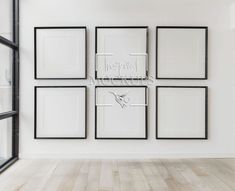 a white wall with six black framed pictures on it