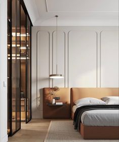 a bed sitting in a bedroom next to a tall glass wall mounted light above it