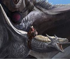 a man riding on the back of a giant dragon next to another person in front of him