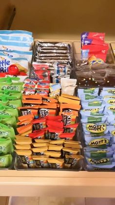 an assortment of snacks on display in a store