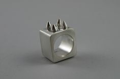 Hollow form silver cube statement ring with four conical spikes on top. This ring is part of the Leslie Series which is about spikes. Hollow Ring, Hollow Form, Ring Inspo, Drawing Stuff, Jewelry Inspo, Statement Ring, Rings Statement, Statement Rings, Jewelry Rings