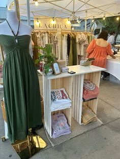 a dress on display under a tent at an outdoor market