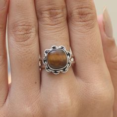 "Tiger Eye Ring / 925 Sterling Silver Ring / Cushion Gemstone Ring / Minimalist Jewelry / Handmade Ring / Personalized gift. Gemstone Name -Tiger Eye  Stone Quality - AAA Ring Wight - 4.33 gm Ring Length - 1.4 cm  Ring Width -   1.4 cm Ring Size - All Ring Size Available. All Our Jewelry Is Stamped 925 . You'll get the exact product as shown in the pictures We serve complete 925 sterling silver Jewelry and genuine properties of the stone. The products are dispatched from the small business from USA. Product Quality and Packaging - Our all products are 925 Silver Stamped which shows that the product is genuine and authentic .The products are dispatched from the small business from USA so you get the product on time and the product packaging comes in bubble foil wrap with all the precautions Adjustable Rings With Natural Stones For Everyday, Minimalist Natural Stone Rings For Everyday, Adjustable Natural Stone Rings For Everyday, Sterling Silver Gemstone Midi Rings, Sterling Silver Open Ring With Gemstone, Sterling Silver Gemstone Midi Rings With Open Design, Handmade Minimalist Sterling Silver Crystal Ring, Adjustable Sterling Silver Stackable Rings With Natural Stones, Minimalist Rings With Natural Stones