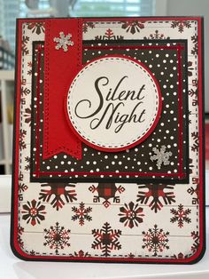 a close up of a card with snowflakes on it and the words silent night